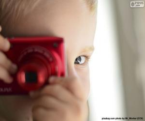 Rompicapo di Bambino con fotocamera fotografica