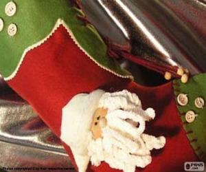 Rompicapo di Calza di Natale decorato con la faccia di Babbo Natale e dei pulsanti