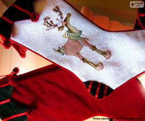 Rompicapo di Calze di Natale e di un rosso decorato con disegni di renne