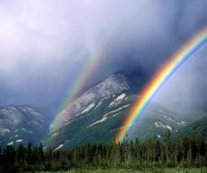 Rompicapo di Paesaggio con arcobaleno, sole, nuvole