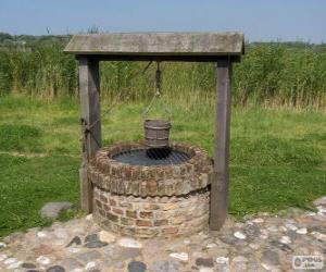 Rompicapo di Pozzo d'acqua di forma cilindrica in pietra