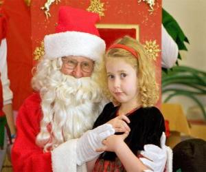 Rompicapo di Ragazza parlando congli Babbo Natale seduta sul tuo grembo