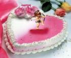 Torta a forma di cuore e Cupido