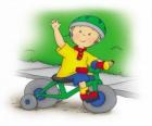 Caillou, in sella a una bicicletta