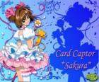 Sakura, il rapitore della carta con uno dei suoi vestiti accanto a Kero