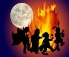 bambini in costume danze intorno al fuoco