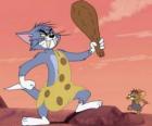 Tom vestito da uomo delle caverne con una mazza per schiacciare Jerry