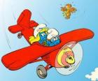Un Puffo e Puffetta pilotare un aereo rosso