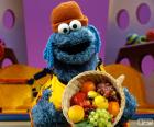 Il Cookie Monster con canestra di frutta