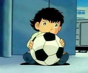 Rompicapo di Tsubasa Ozora, Oliver Hutton, un bambino giapponese che è un grande appassionato di calcio